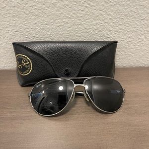 Ray-Ban sunglasses with case and cleaning wipe.